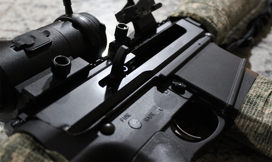 Close-up of the upper receiver of a side-charging AR-10 rifle